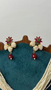 Detailed view of earrings design.