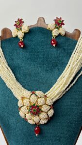 Close-up of necklace and earrings.